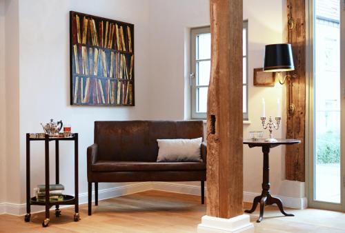 a living room with a couch and a table at Hotel No. 11 in Lüdinghausen