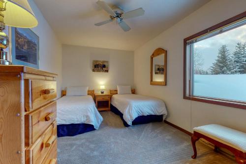 a bedroom with two beds and a window at St John C in Jackson