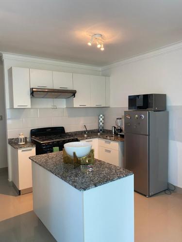 Dapur atau dapur kecil di JCS SEIJAS APARTAMENT Recidence and Beach Club, 3E