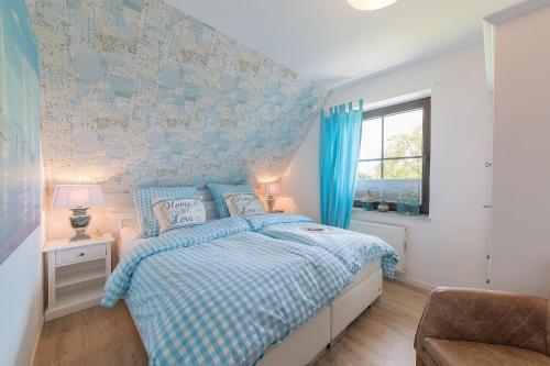 Postel nebo postele na pokoji v ubytování Haus am Strand Ferienwohnung Haus am Strand 3