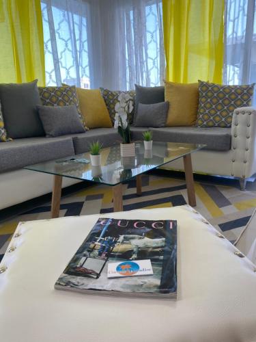 a living room with a couch and a table at JCS SEIJAS APARTAMENT Recidence and Beach Club, 3E in Pajarito