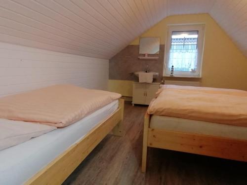 Postel nebo postele na pokoji v ubytování Ferienwohnung an der Strandstrasse