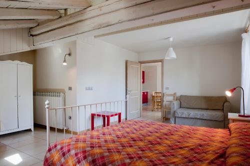 a bedroom with a bed and a living room at Residence Redivalle in Passo del Tonale