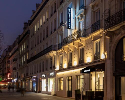 a building on a city street at night at Montfleuri in Paris