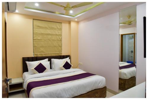 a bedroom with two beds in a room at Hotel Siddharsh Heritage in Jaipur
