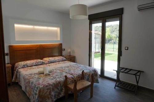 Postel nebo postele na pokoji v ubytování Casas Rurales Laguna La Tinaja