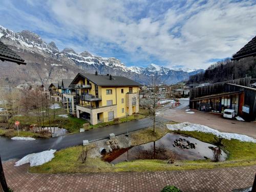 an aerial view of a town with a mountain at Walensee House & Apartments in Unterterzen