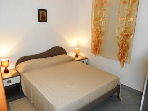 Postel nebo postele na pokoji v ubytování Casa Ginepri C