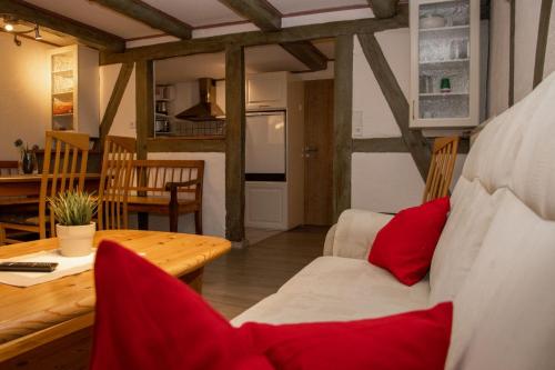 a living room with a couch and a table at Xavers Ranch in Meschede