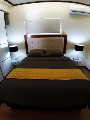 Ein Bett oder Betten in einem Zimmer der Unterkunft Liberdada Suites