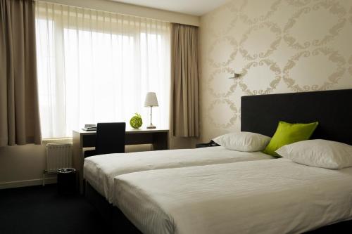 Ένα ή περισσότερα κρεβάτια σε δωμάτιο στο Hotel Essenza