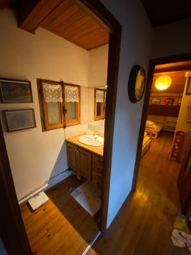 a bathroom with a sink and a mirror at Chalet de l'Esquirol in Bolquere Pyrenees 2000