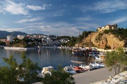 a group of boats docked in a harbor at Katerina Studios in Limenaria