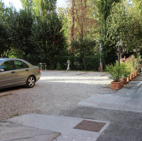 a car parked in a parking lot at Albergo Moderno in Modena