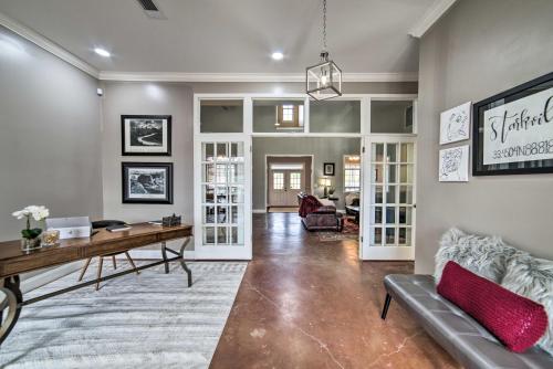 a living room with a desk and a couch at Starkvegas Clubhouse about 2 Mi to MSU Campus! in Starkville