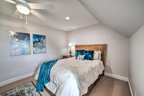 a bedroom with a large bed with blue pillows at Starkvegas Clubhouse about 2 Mi to MSU Campus! in Starkville