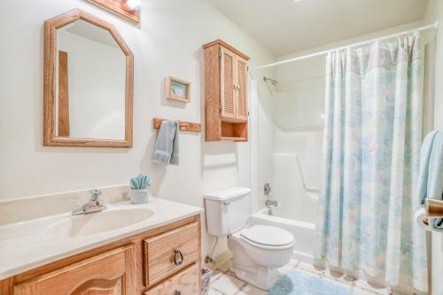 a bathroom with a sink and a toilet and a shower at Sea Gem MCA 395 - Meredith Lodging in Manzanita