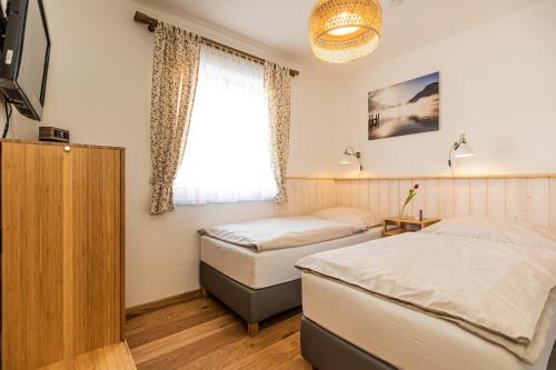 En eller flere senge i et værelse på Tonis Apartment