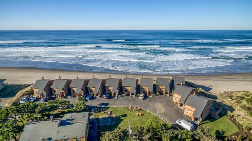 an aerial view of the beach and the ocean at Breakers Beach House 1 - Meredith Lodging in Neskowin