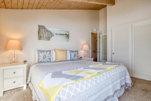 a bedroom with a large bed and two lamps at Breakers Beach House 4 - Meredith Lodging in Neskowin