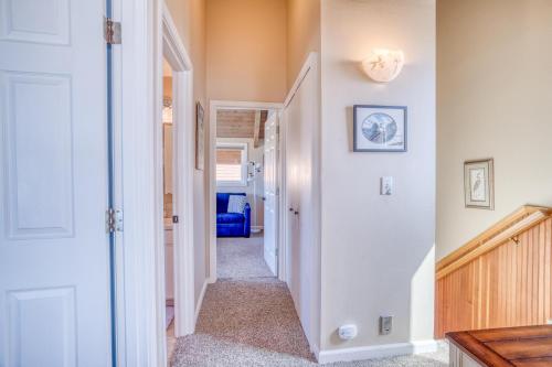 a hallway of a home with white walls at Breakers Beach House 9 - Meredith Lodging in Neskowin