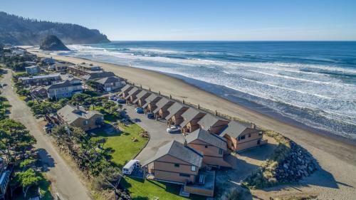 an aerial view of a beach with houses at Breakers Beach House 9 - Meredith Lodging in Neskowin