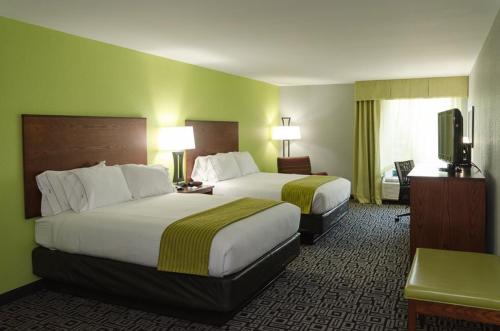 a hotel room with two beds and a flat screen tv at Holiday Inn Express Hickory - Hickory Mart, an IHG Hotel in Hickory