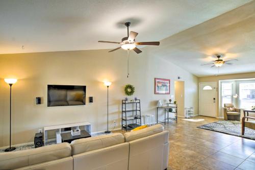 a living room with a couch and a ceiling fan at Near Golf and Entertainment! Gilbert Family Getaway in Gilbert