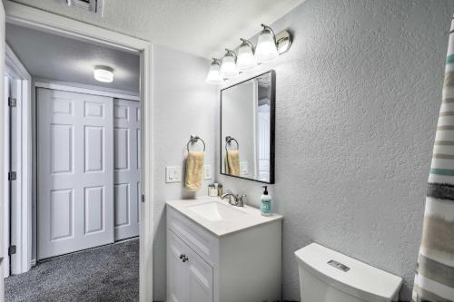 a white bathroom with a sink and a mirror at Sedona Escape Walk to Dining, 7 Mi to Uptown! in Sedona