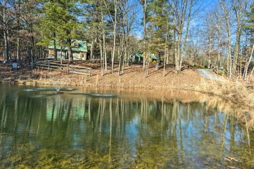 a view of a pond with a park in the background at Berkeley Springs Haven with Sleepy Creek Access! in Berkeley Springs