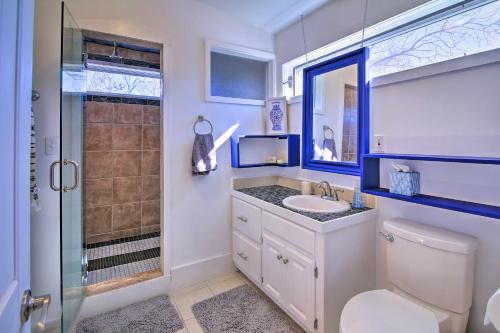 a bathroom with a toilet sink and a shower at Texas Home with Backyard Oasis, Walk to Main St in Fredericksburg