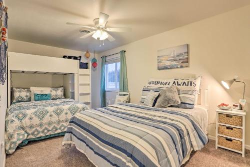 a bedroom with two beds and a ceiling fan at Lake McConaughy Getaway with Covered Patio in Belmar