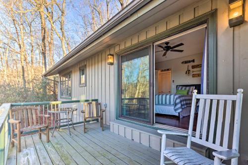 a porch of a house with a bed and a window at Brevard Home with Panoramic Lake and Mountain Views! in Brevard