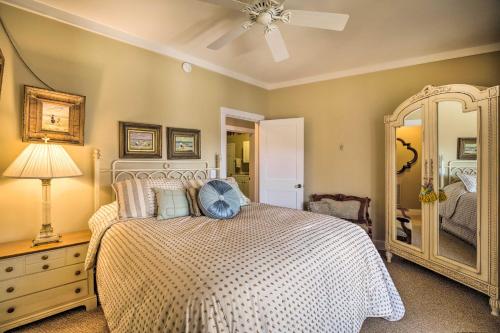 a bedroom with a bed and a dresser and a mirror at Waterfront Home on Norris Lake with Boat Slip! in La Follette