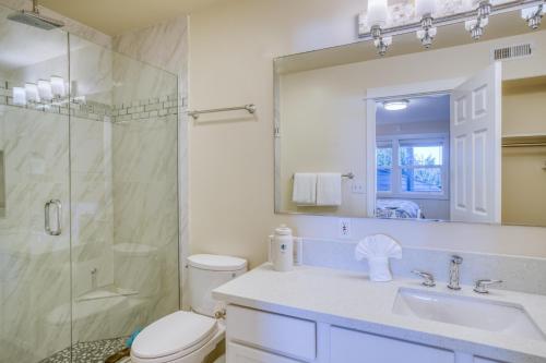 a bathroom with a toilet and a sink and a shower at Beauty On The Beach in Depoe Bay