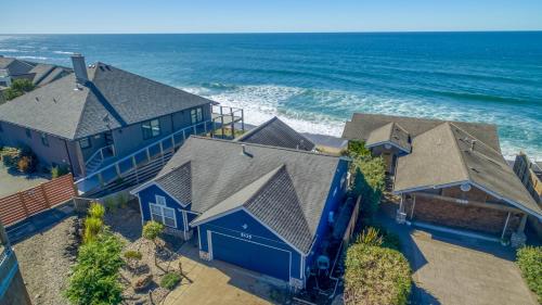 an aerial view of a house with the ocean at Beauty On The Beach in Depoe Bay