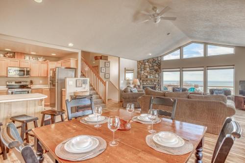 a dining room and living room with a table and chairs at Hubbert Hideaway in Lincoln City