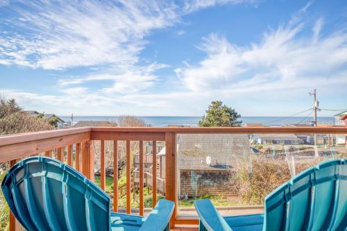 a deck with chairs and a view of the ocean at Hubbert Hideaway in Lincoln City