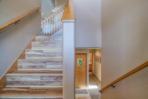 a staircase with wood treads in a house at Hubbert Hideaway in Lincoln City