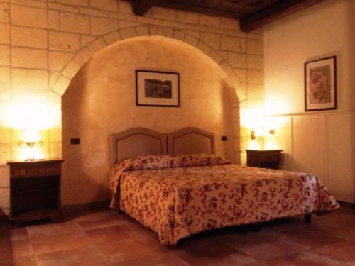 Ένα ή περισσότερα κρεβάτια σε δωμάτιο στο Hotel Tenuta San Francesco