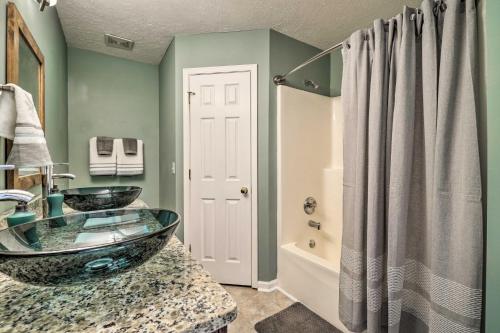 a bathroom with two sinks and a shower at Suburban Getaway with Game Room, 19 Mi to Nashville! in Hunters Store