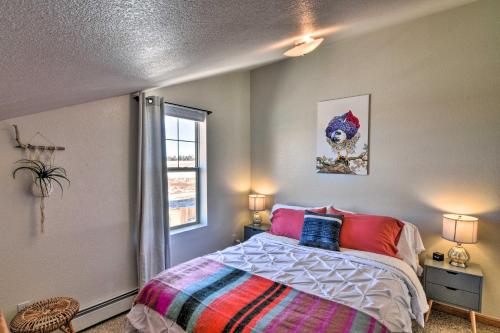 a bedroom with a bed and a window at 503 Mountain Loft with Views 1 Mi to Dwtn Fairplay! in Fairplay