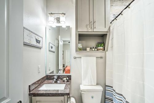 a small bathroom with a toilet and a sink at Chic Edinburg Escape Hike, Fish, and Explore! in Edinburg
