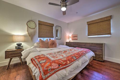 a bedroom with a large bed and a ceiling fan at 6 Mi to Dtwn Austin Home with Screened Porch and Yard in Austin