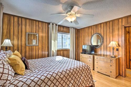 a bedroom with a bed and a ceiling fan at Beech Mtn Condo w/ Slope View & Resort-Style Perks in Beech Mountain