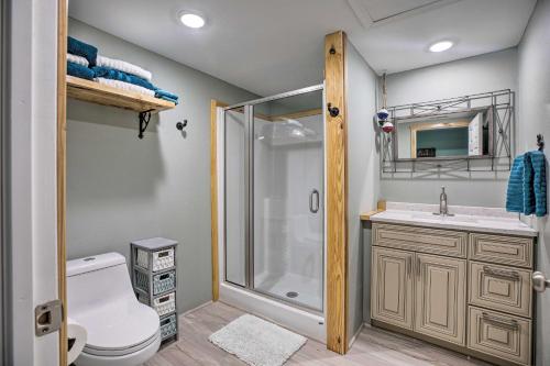a bathroom with a shower and a toilet and a sink at Outdoor Family Fun Large Home by Beaver Lake! in Eureka Springs