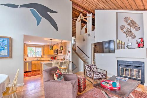 a living room with a dolphin on the wall at Spacious Village of Loon Home Less Than 1 Mi to Ski Slopes in Lincoln