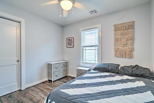 a bedroom with a bed and a window at Beach Retreat with BBQ, Patio and Outdoor Shower! in Seaside Heights