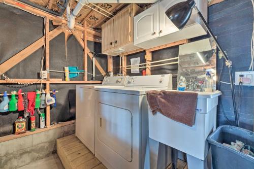 a kitchen with a washing machine and a sink at Serene Hudson Home on Canal with Direct Gulf Access in Hudson