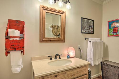 a bathroom with a sink and a mirror at Cozy and Quiet Studio with Porch, Near Scenic Railway! in Blue Ridge